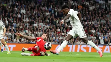 فينيسيوس جونيور وأوتاميندي لاعبا ريال مدريد وبنفيكا (Getty)